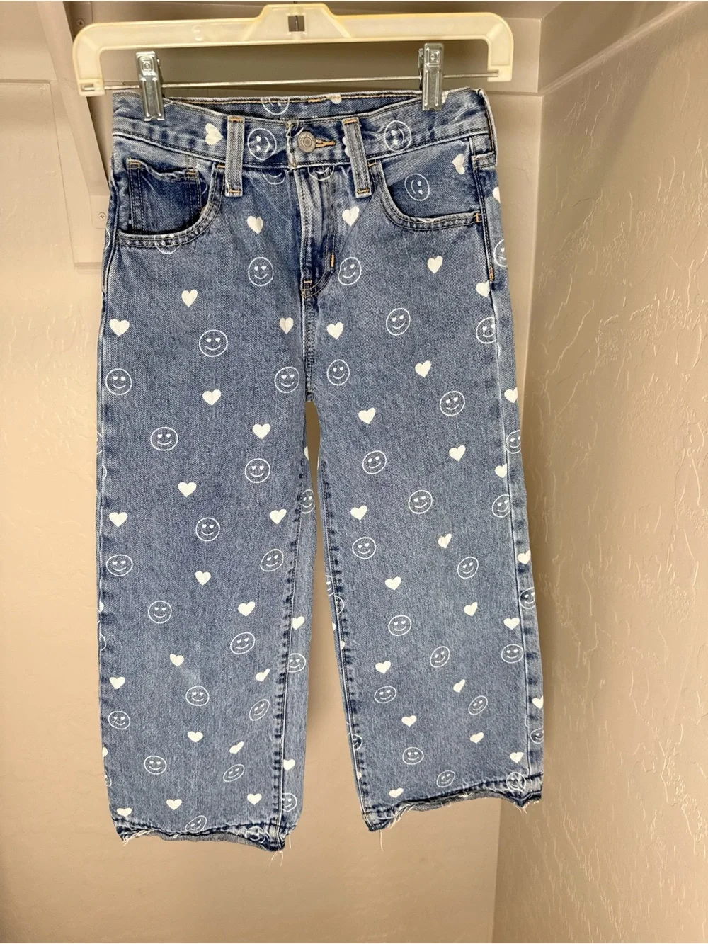 Girls Old Navy baggy wide leg jeans with white smile & heart print